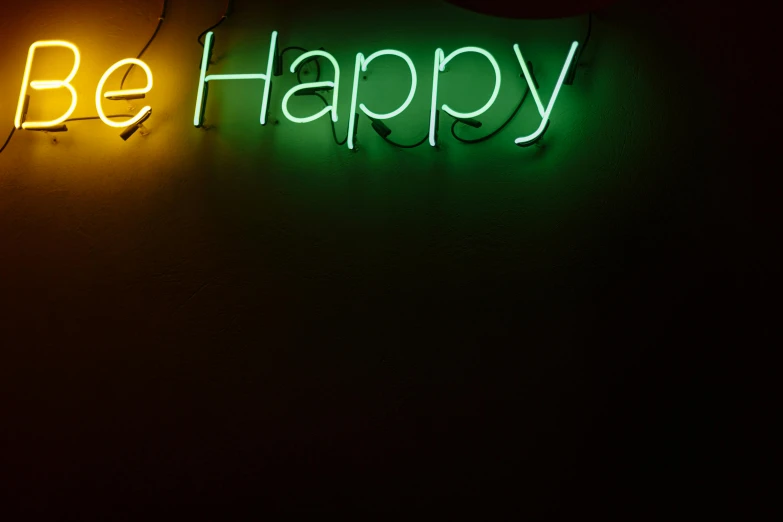 a neon sign that says be happy on a wall, inspired by Bruce Nauman, pexels, medium closeup, carefree, indoor picture, she is happy