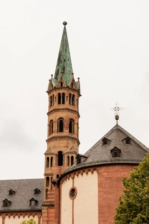 a tall tower with a clock on top of it, inspired by Rainer Maria Latzke, romanesque, lead - covered spire, pink marble building, details visible, panorama