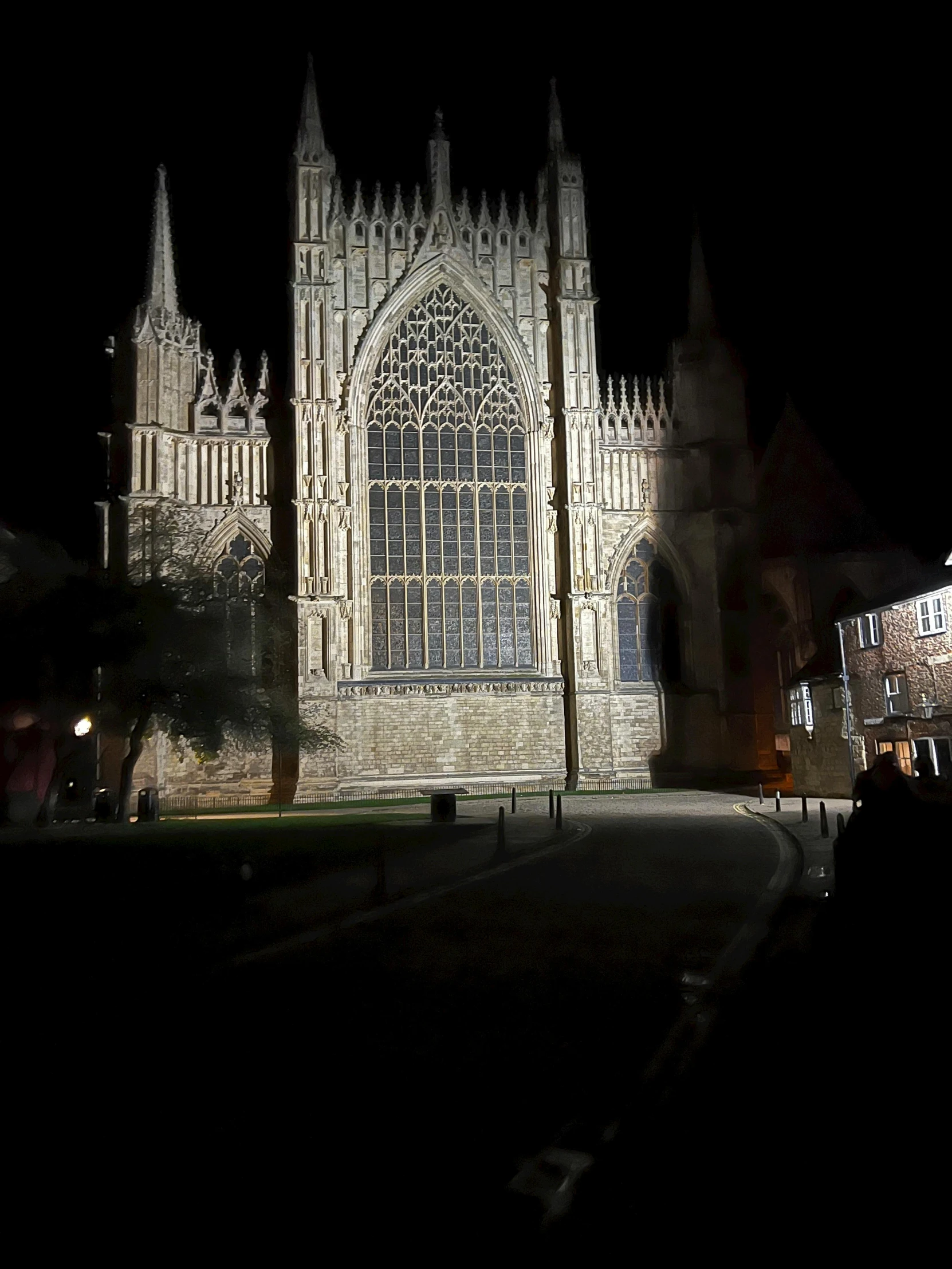 a large cathedral is lit up at night, by Kev Walker, photo of poor condition, very very low quality picture, very accurate photo, nighttime!!