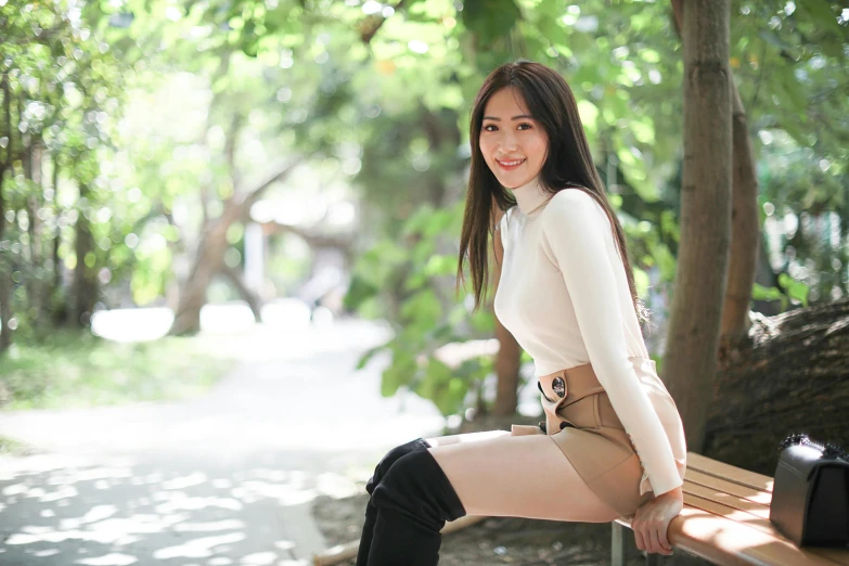 a woman sitting on top of a wooden bench, inspired by Ni Yuanlu, pexels contest winner, round thighs, with a long white, student, beautiful and smiling