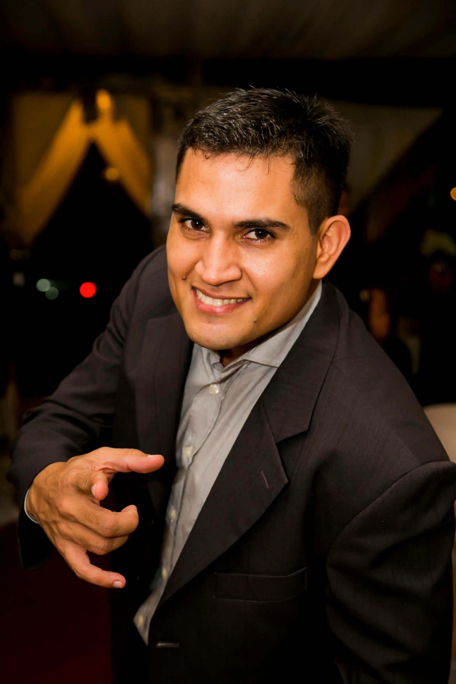 a man in a suit pointing at the camera, inspired by Randy Vargas, profile image, single, night life, rectangle