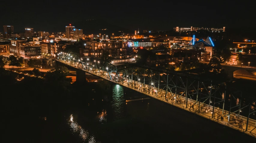 an aerial view of a city at night, by Dan Frazier, pexels contest winner, standing on a bridge, festival. scenic view at night, portland oregon, view from the side