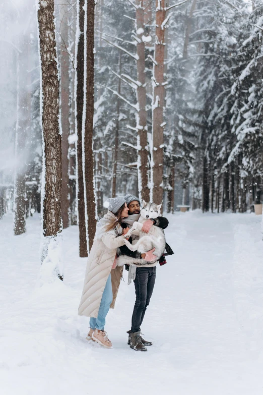 a man and a woman kissing in the snow, by Julia Pishtar, pexels contest winner, enjoying a stroll in the forest, with a kid, 🚿🗝📝