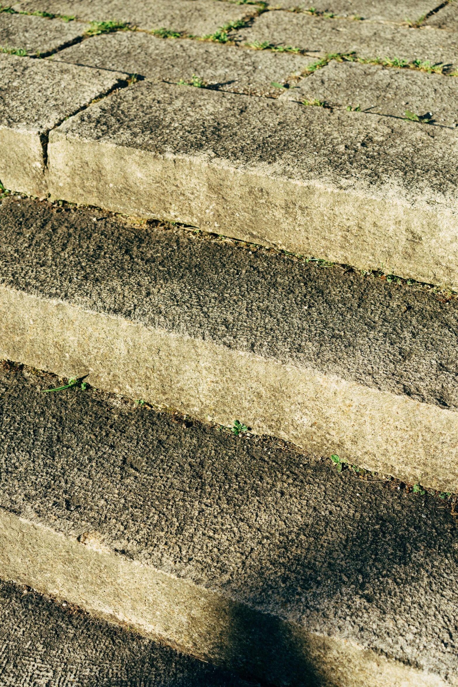 a red fire hydrant sitting on top of cement steps, an album cover, inspired by Louis Stettner, brutalism, natural stone road, grey, large staircase, striations