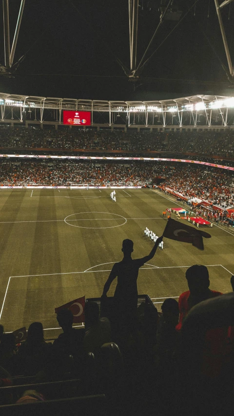 a crowd of people watching a soccer game, pexels contest winner, hurufiyya, standing in a stadium, turkey, set on singaporean aesthetic, thumbnail