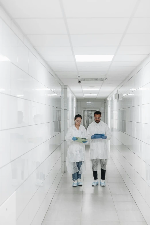 a couple of people that are standing in a hallway, clean medical environment, multiple stories, science, michal mraz