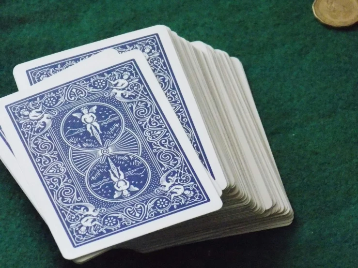 a pile of playing cards sitting on top of a table, blue, rider waite card, image, ramps