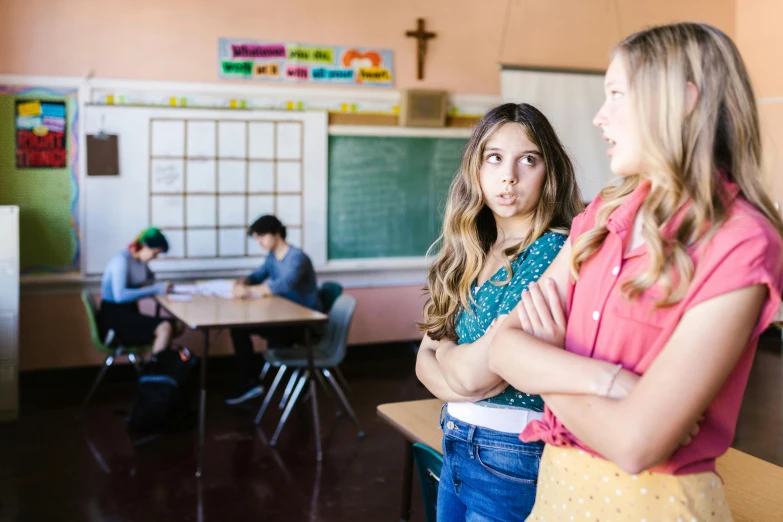 two girls standing next to each other in a classroom, trending on pexels, religious awe, sydney sweeney, teenage boy, looking threatening