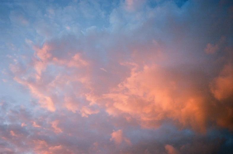 there is a plane that is flying in the sky, by Jan Rustem, unsplash, romanticism, pink and teal and orange, “puffy cloudscape, early evening, major arcana sky
