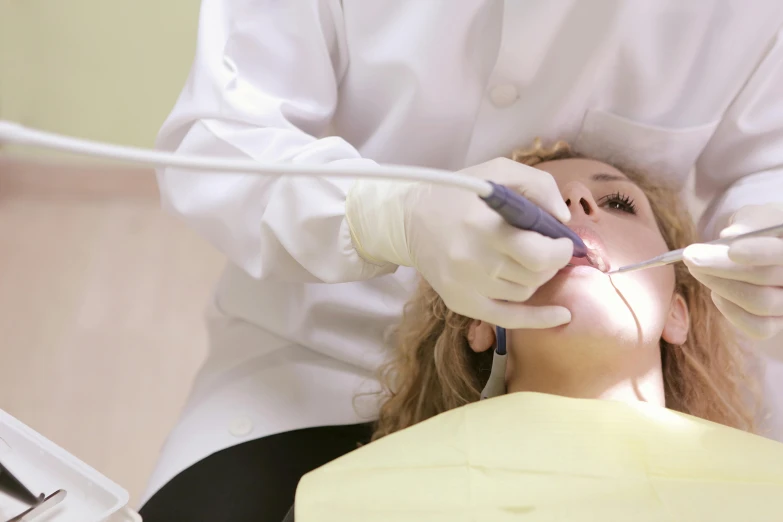 a woman getting her teeth examined by a dentist, by Adam Marczyński, shutterstock, square jaw-line, with electric arc devices, youtube thumbnail, 4 k pores