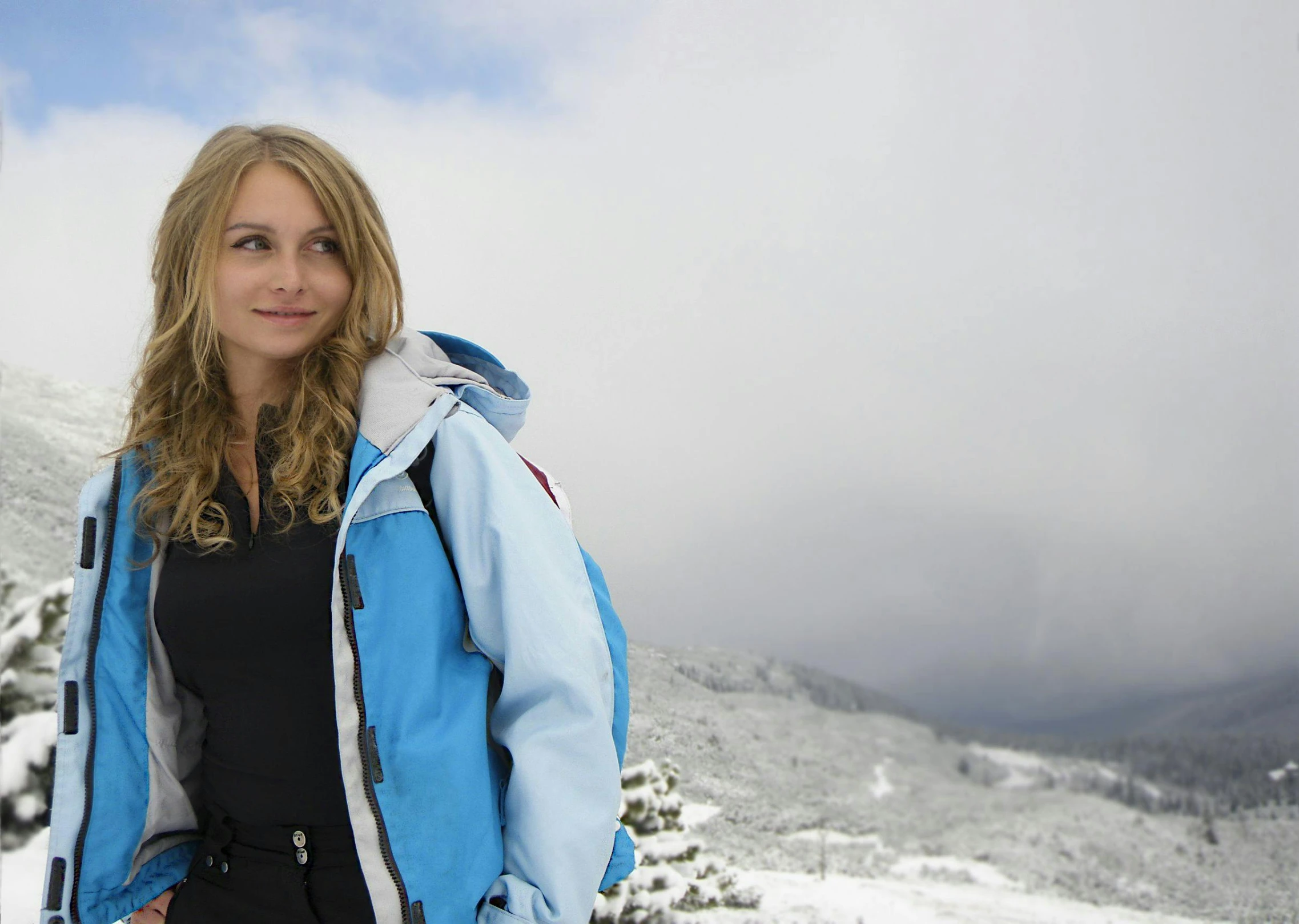 a woman standing on top of a snow covered slope, a portrait, flickr, chloe moretz, portrait image, hiking clothes, documentary still