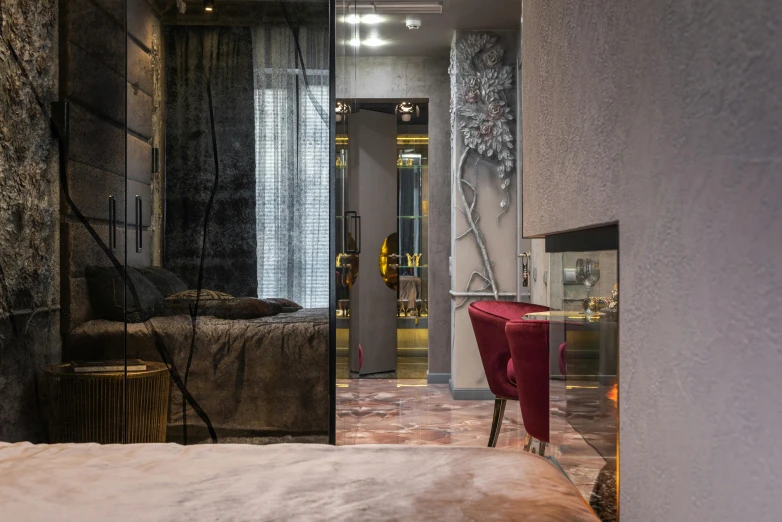 a bed room with a neatly made bed and a red chair, pexels contest winner, art nouveau, stone and glass and gold, cyberpunk apartment, neo kyiv, cosy fireplace