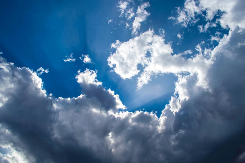 the sun is shining through the clouds in the sky, by Jan Rustem, unsplash, romanticism, azure blue sky, ceremonial clouds, silver lining, journalism photo