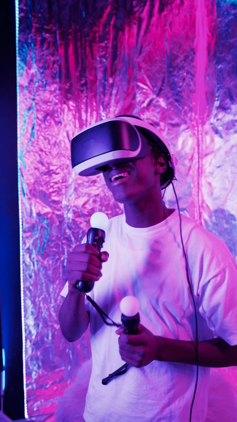 a man in a white shirt holding a microphone, a hologram, inspired by Beeple, pexels, afrofuturism, wearing a vr headset, brightly lit purple room, looking happy, hyper reali sm