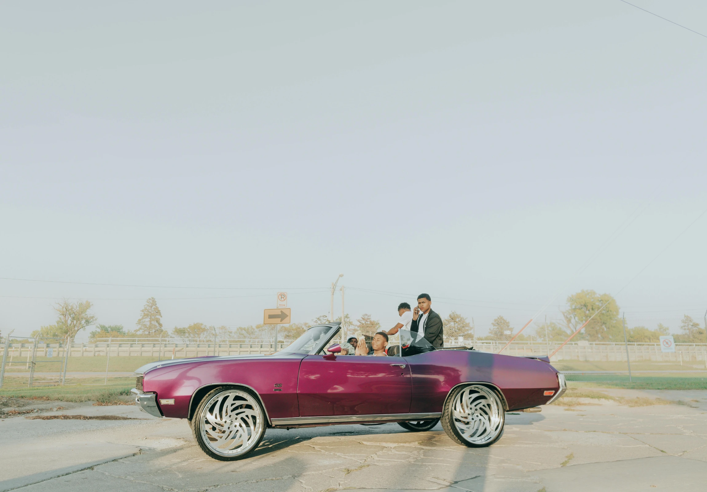 a man and a woman in a pink convertible car, an album cover, by Winona Nelson, pexels contest winner, ghetto, purple tornado, 3 / 4 wide shot, full body in shot