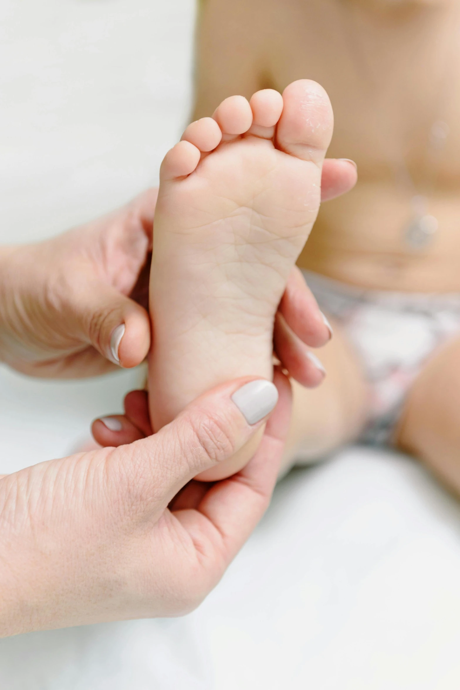 a close up of a person holding a baby's foot, professional modeling, diagnostics, square, performance