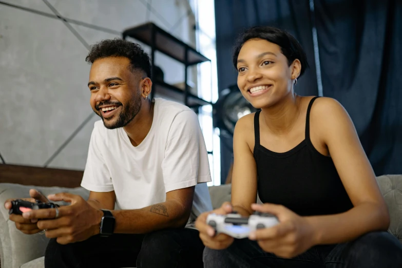 a man and a woman sitting on a couch playing video games, pexels contest winner, avatar image, sport game, smug smile, mkbhd