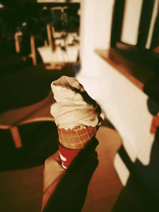 a person holding an ice cream cone in their hand, inspired by Elsa Bleda, unsplash, photorealism, ignant, holga, 2 0 0 0's photo, red velvet