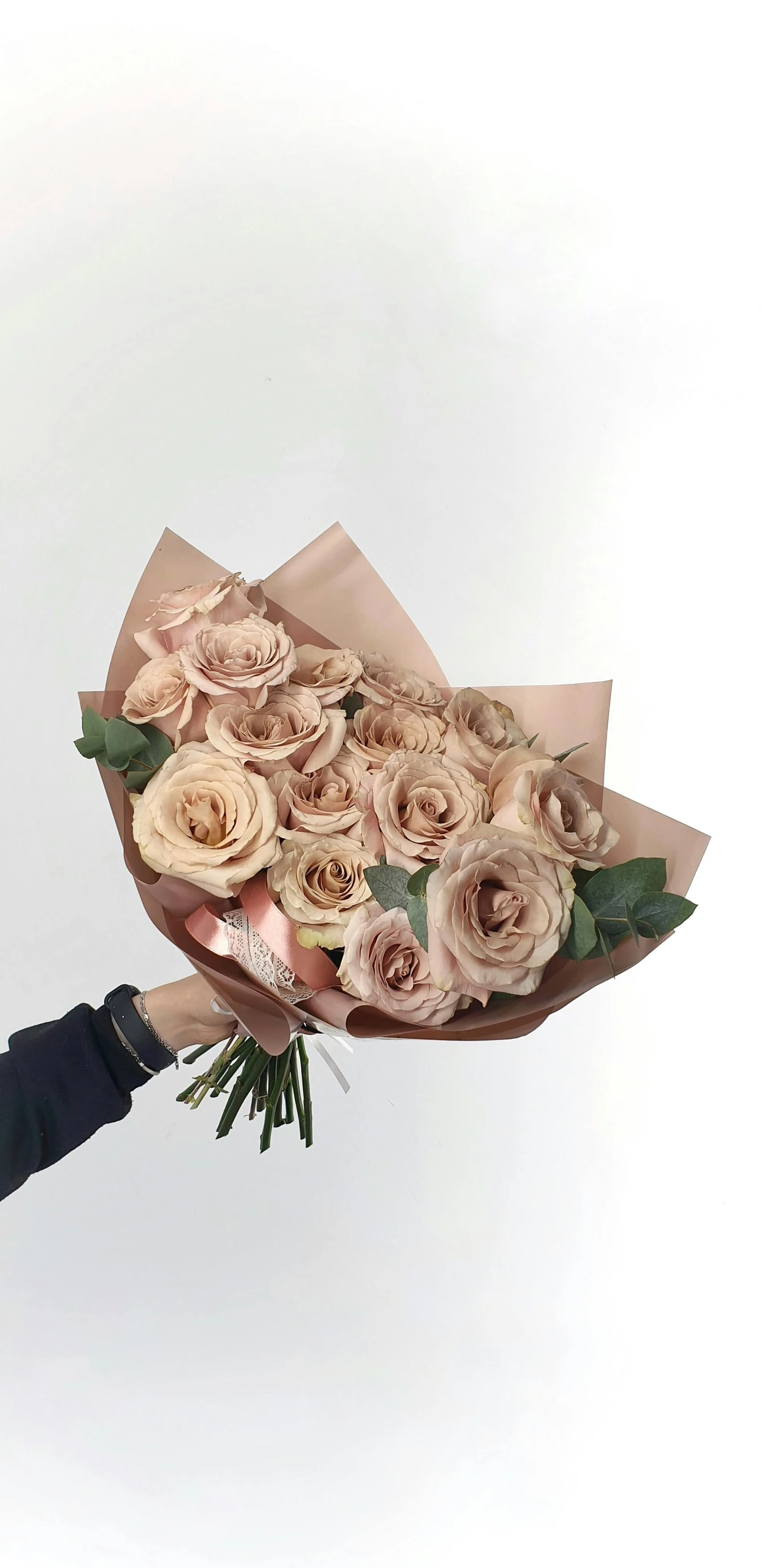 a woman holding a bouquet of pink roses, inspired by François Boquet, instagram, muted browns, sleek, 2995599206, angled shot