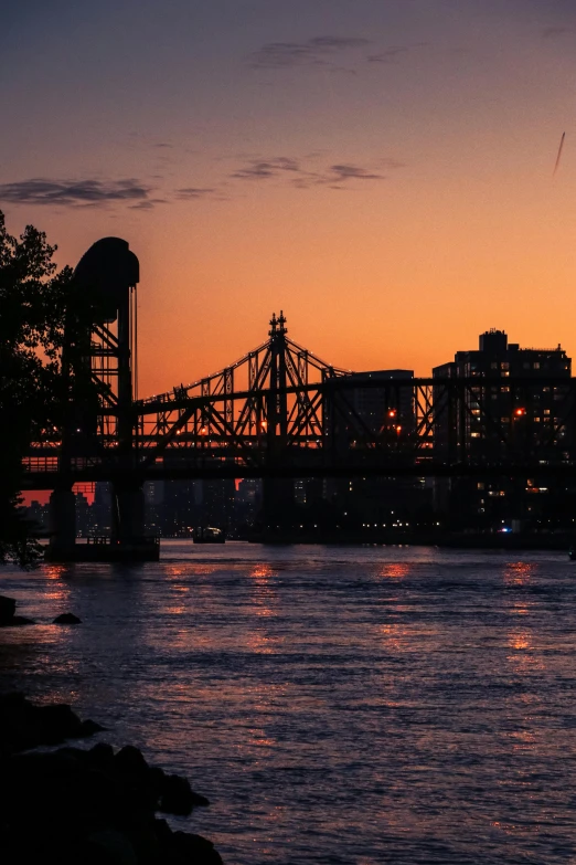 a body of water with a bridge in the background, city sunset, slide show, nyc, digital image