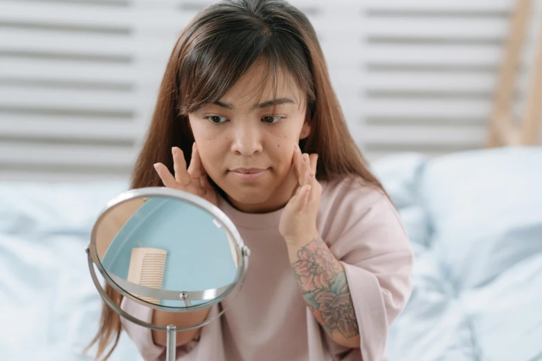 a little girl that is standing in front of a mirror, round jawline, manuka, with facial tattoo, upper body image