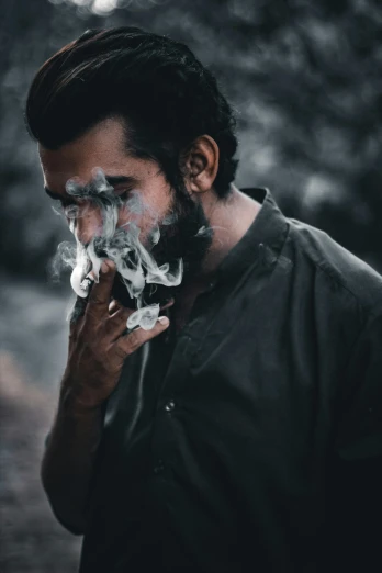a man with a beard smoking a cigarette, pexels contest winner, a photo of a disheveled man, trail of smoke, sage smoke, ✨🕌🌙