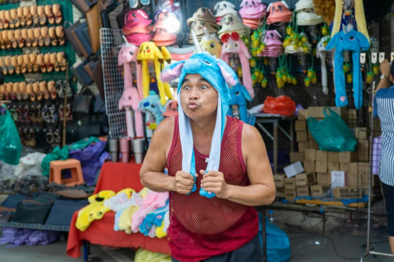 a man that is standing in front of a store, a portrait, pexels contest winner, toyism, wearing a silly hat, manila, avatar image, bandanas