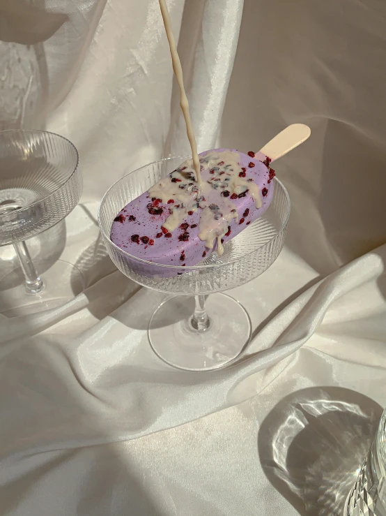 a purple cake sitting on top of a glass plate, lofi girl aesthetic, vanilla smoothie explosion, 🌺 cgsociety, spoon placed