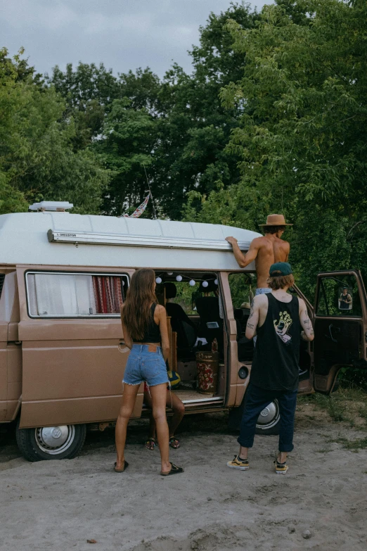 a group of people standing in front of a van, unsplash contest winner, renaissance, 1 9 7 0 s, tans, massive wide trunk, roaming the colony