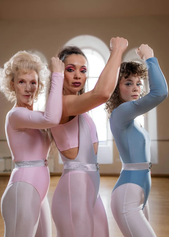 a group of three women standing next to each other, an album cover, inspired by Louisa Matthíasdóttir, in spandex suit, pastel blues and pinks, arms out, wearing white leotard
