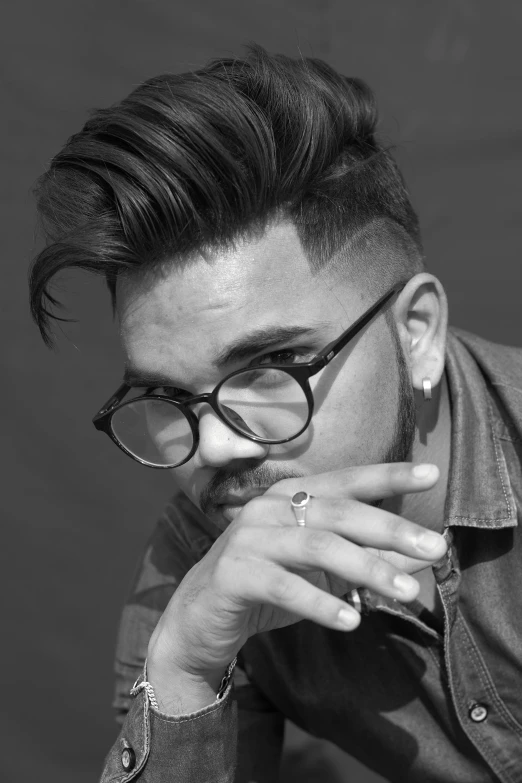 a black and white photo of a man with glasses, a black and white photo, pexels contest winner, undercut haircut, ray william johnson, ariel perez, phong shaded