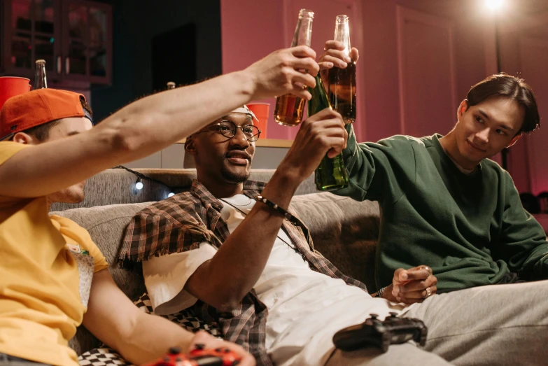 a group of men sitting on top of a couch, pexels, happening, cinematic beer, gamer themed, holding a glass of wine, two buddies sitting in a room