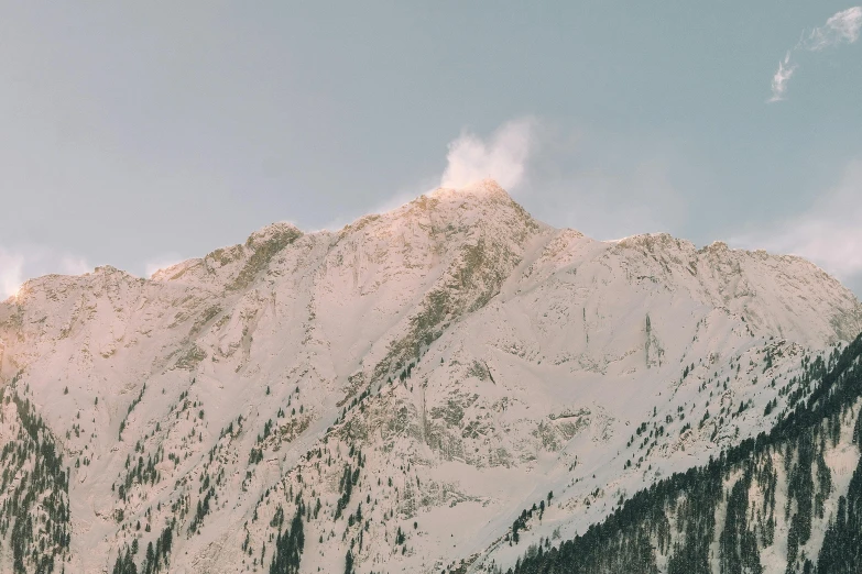 a person riding a snowboard on top of a snow covered mountain, pexels contest winner, white steam on the side, seen from a distance, sunfaded, 1 7 9 5