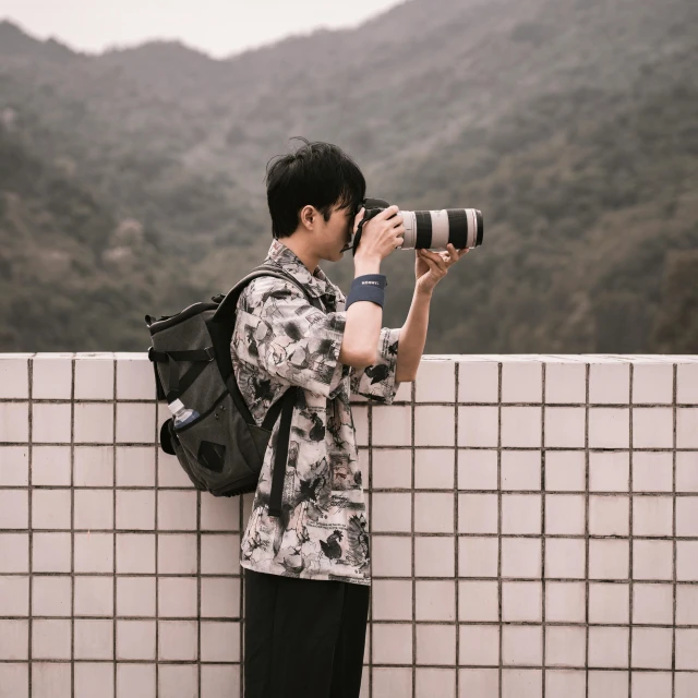 a man taking a picture with a camera, a picture, by David Diao, pexels contest winner, japan travel aesthetic, telephoto vacation picture, full body in camera, gif