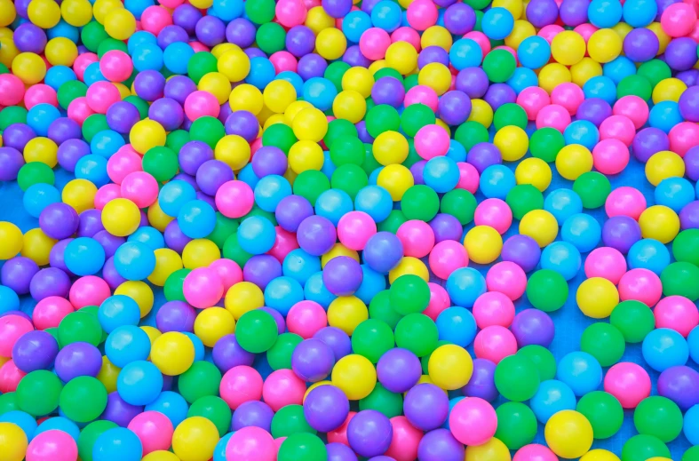 a ball pit filled with lots of colorful balls, a digital rendering, inspired by Peter Alexander Hay, pixabay, color field, turquoise pink and yellow, closeup, purple and pink and blue neons, pbr materials