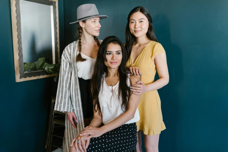 three women standing next to each other in a room, a portrait, unsplash, jamie chung, portrait image
