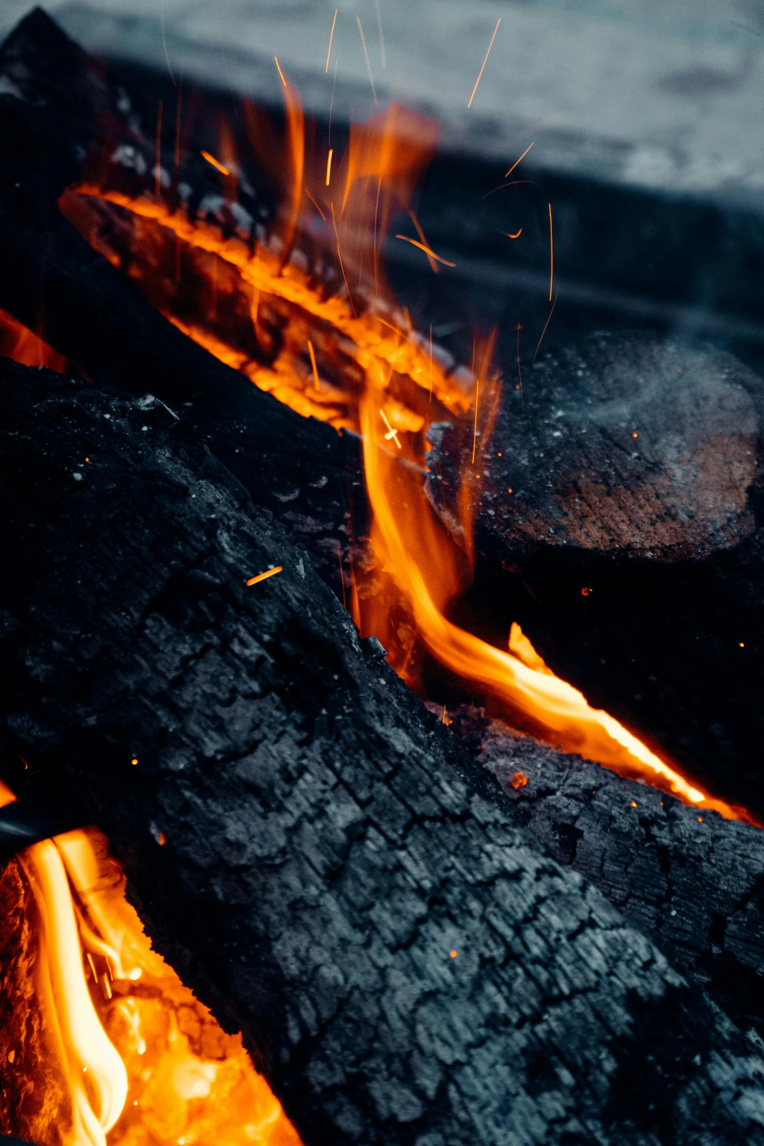 a close up of a fire with flames coming out of it, pexels contest winner, smouldering charred timber, black, relaxing, vanilla