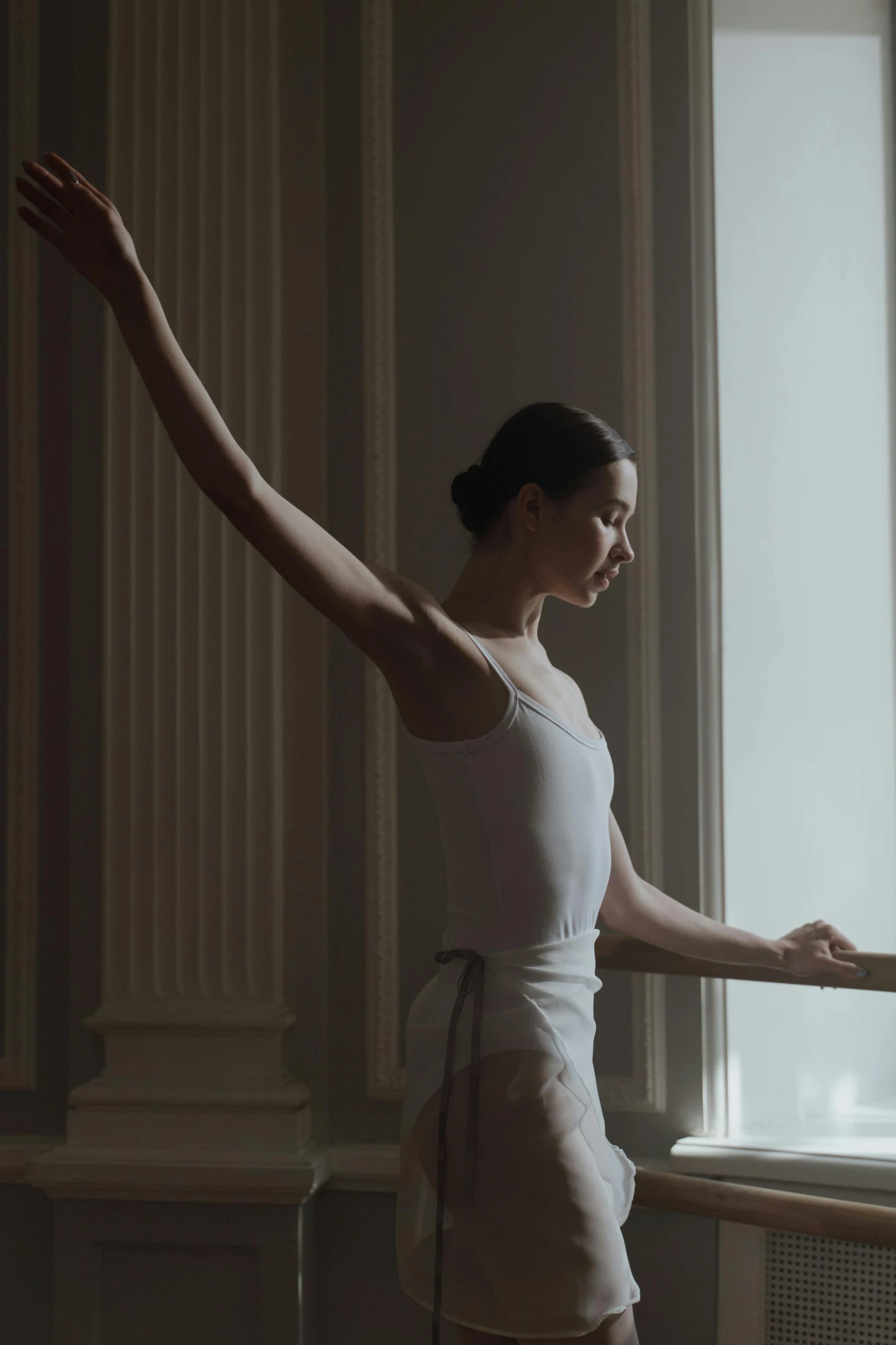 a woman that is standing in front of a window, by Elizabeth Polunin, arabesque, **cinematic, lower quality, lut, emily rajtkowski