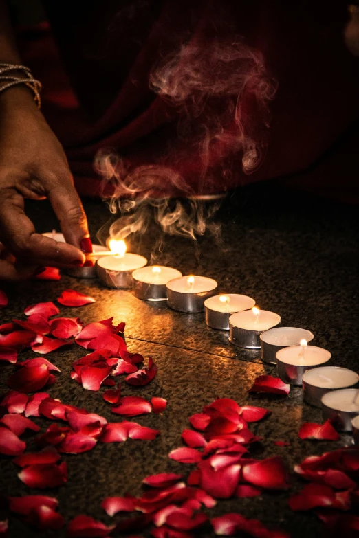 a person lighting candles in the shape of a heart, pexels contest winner, provocative indian, petals, lights and smoke, 15081959 21121991 01012000 4k