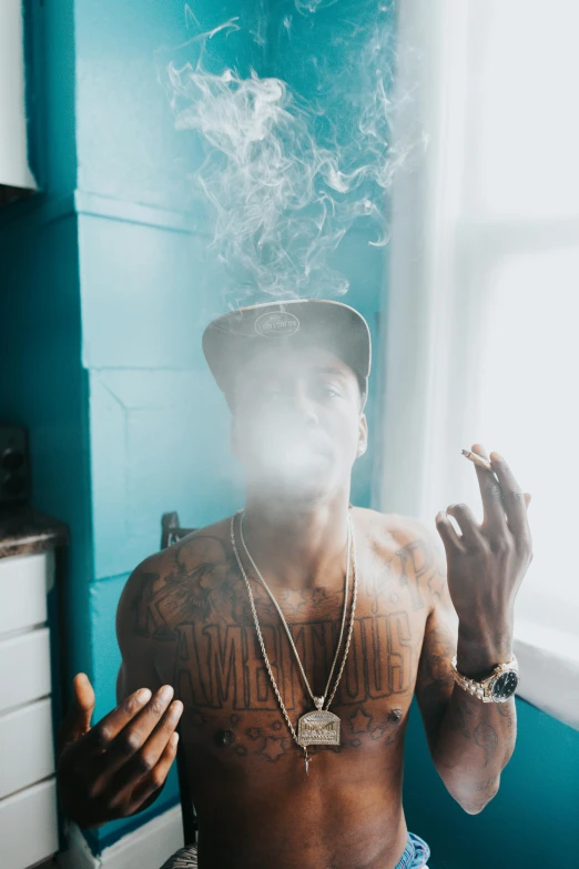 a shirtless man smoking a cigarette in a kitchen, a tattoo, trending on pexels, visual art, nipsey hussle, pot leaf, covered in clouds, teal aesthetic