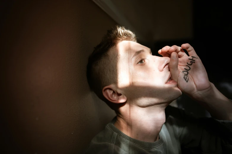 a man that has a tattoo on his face, a photo, pexels contest winner, hyperrealism, light from right, vitalik buterin, drinking, ptsd