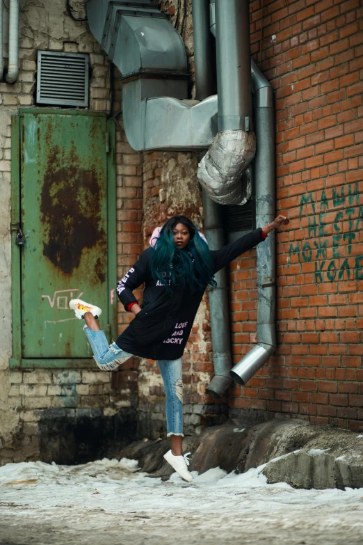 a man flying through the air while riding a skateboard, an album cover, pexels contest winner, graffiti, black young woman, anna nikonova aka newmilky, pose(arms up + happy), wearing jeans and a black hoodie