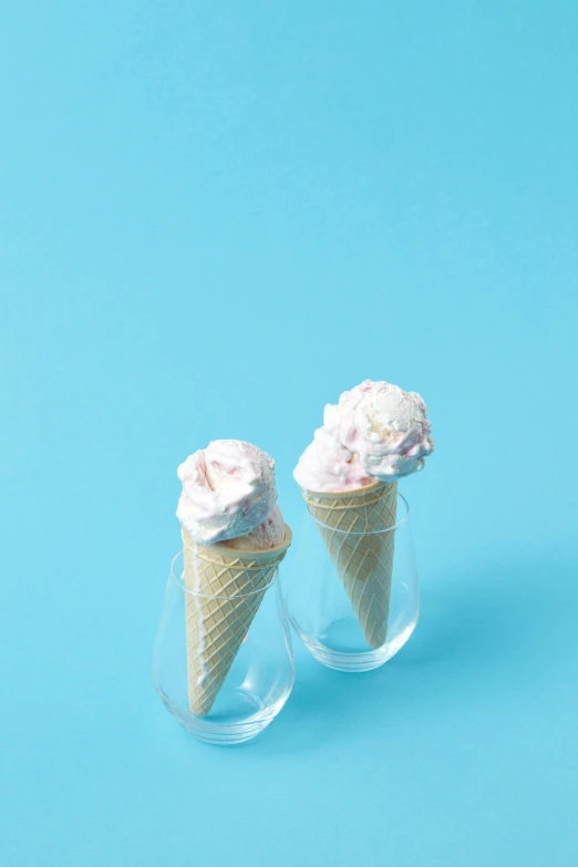 two cones of ice cream on a blue background, unsplash, featuring pink brains, epicurious, drink, white background
