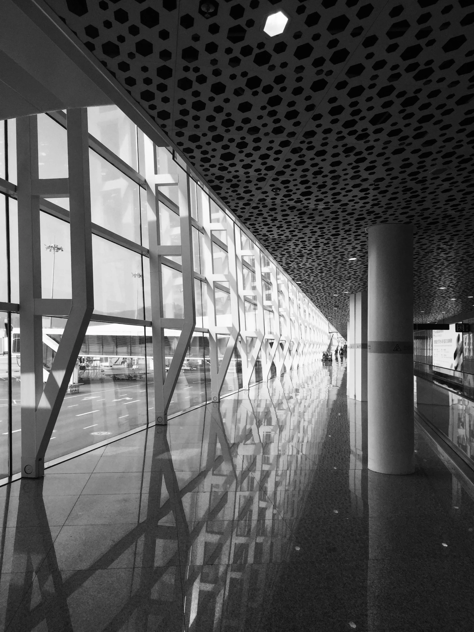 a black and white photo of an airport, by Zha Shibiao, unsplash, light and space, full of glass. cgsociety, square, street photo, sunny day