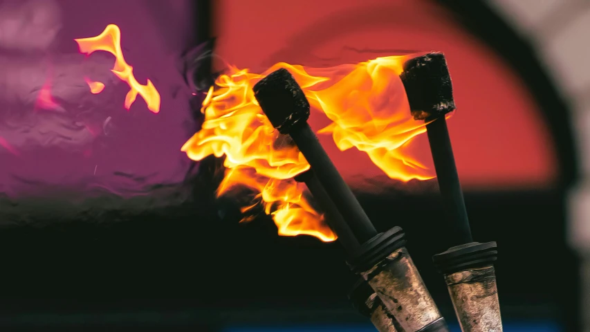 a close up of a fire with flames coming out of it, by Jay Hambidge, pexels contest winner, fine art, hammers, olympics, brochure, purple and scarlet colours