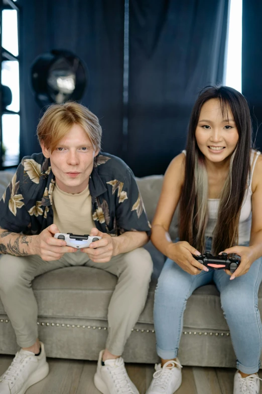 two people sitting on a couch playing video games, by Julia Pishtar, tony hawk, half asian, hollywood promotional image, single