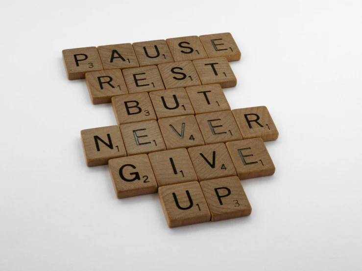wooden scrabbles spelling pause rest but never give up, a picture, inspired by Paul Harvey, unsplash, happening, workout, nursing, thumbnail, 8 h