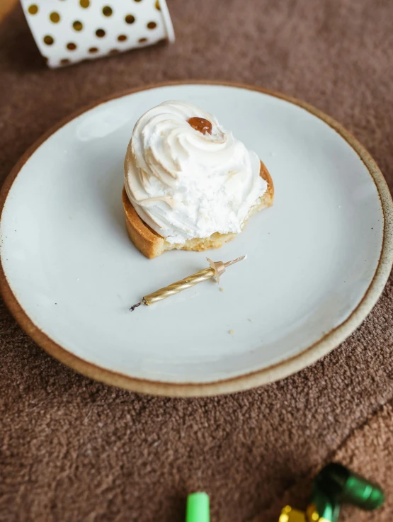 a white plate topped with a pastry on top of a table, marshmallow, thumbnail, oceanside, magnolia