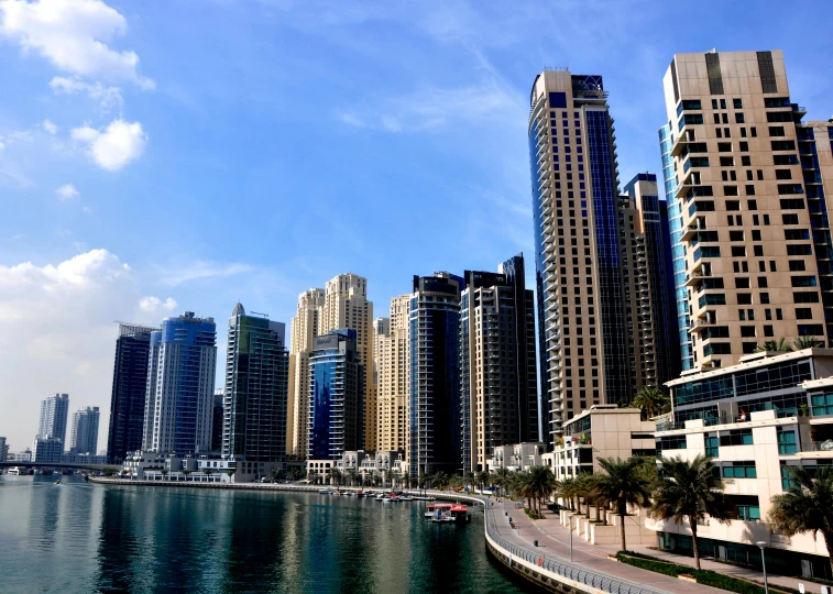 a large body of water surrounded by tall buildings, pexels contest winner, hurufiyya, middle eastern, bright sunny day, group photo, multiple stories