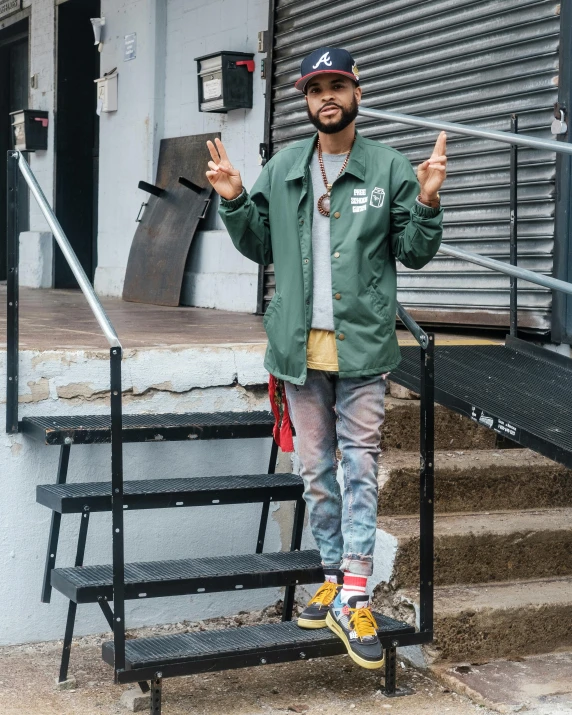 a man standing on the steps of a building, by Robbie Trevino, teddy fresh, wearing jacket, duck shoes, 8 k photo